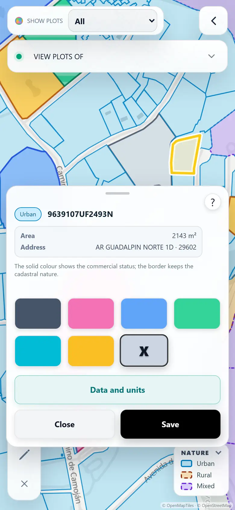 The cadastral map on a phone, with the parcel card sliding up from the bottom and the colours to mark the outcome at each door